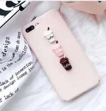 Soft pink silicone iPhone case with a raised 3D cartoon cat design on the back.