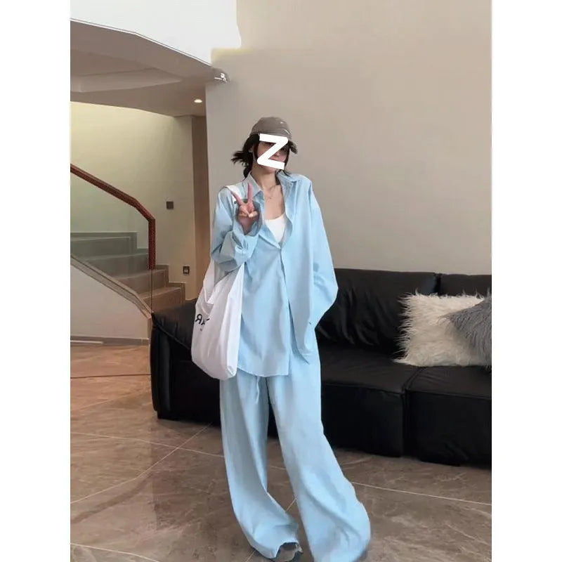 Women's blue shirt and wide-leg pants suit with flight sleeve and button stitching details