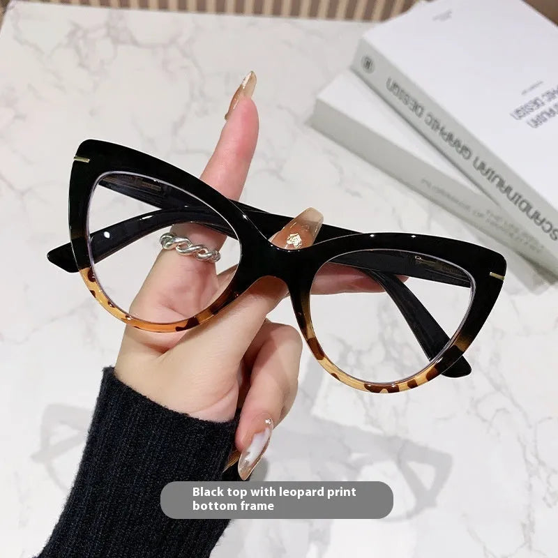 Women's cat eye reading glasses with large frames showing dragon and phoenix decorations