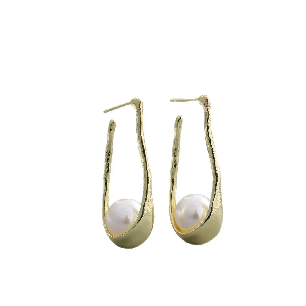 Vintage irregular pearl clip-on earrings in gold colour for women, fashion accessory