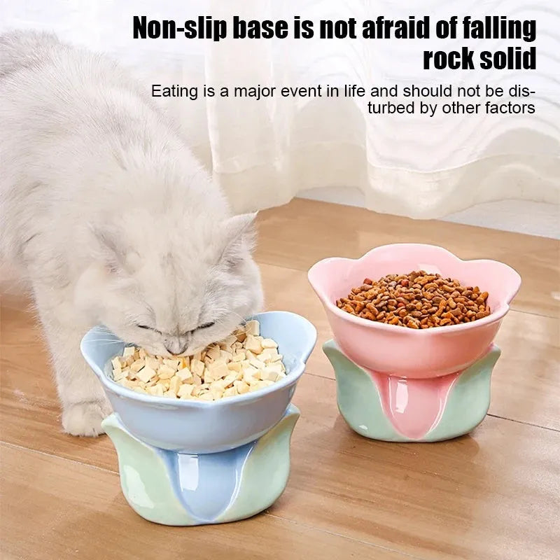 Blue ceramic raised pet bowl with floral pattern and non-slip base for cats and small dogs.