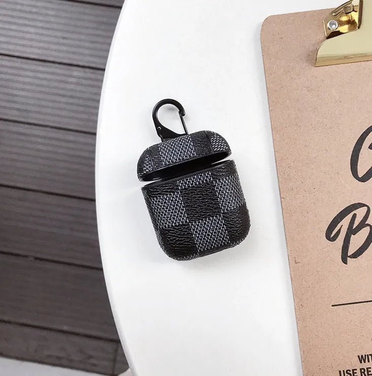 Black lattice hard shell case for iPhone XS Max and AirPods with anti-lost hook attached.