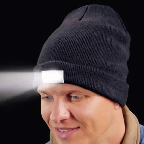 LED headlamp glowing knit warm hat in beige with built-in flashlight for camping