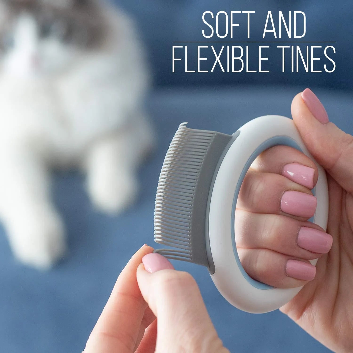 Blue pet grooming comb for cats and dogs on a white background, showing ergonomic handle and soft teeth.