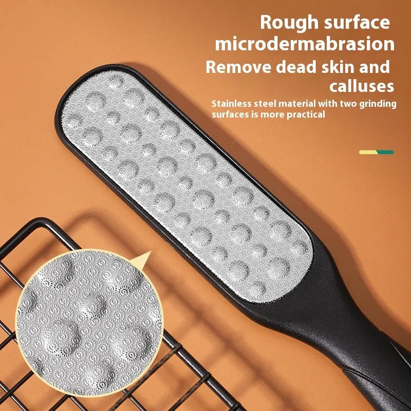 Double-sided stainless steel foot grinder with black and white abrasive pads for foot care