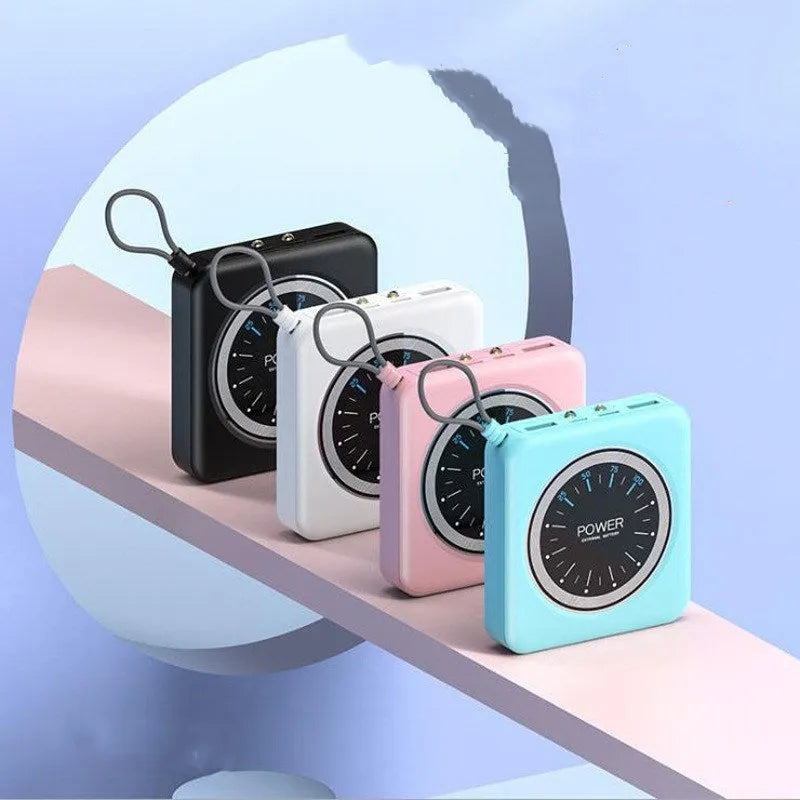 Compact mini clock charger power bank in mint green showing multi-USB ports and alloy case.