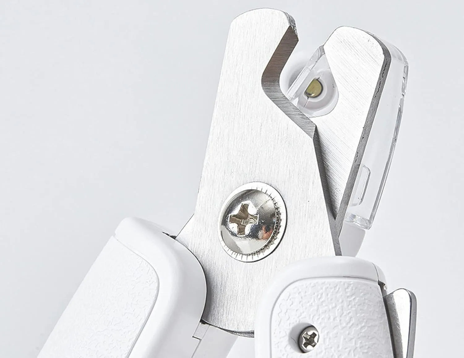 White pet nail clippers with LED light, anti-splash transparent guard, and a leather-like handle on a blue background.
