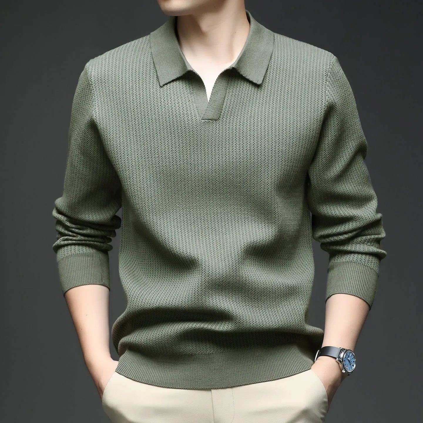 Men's loose fit long sleeve pullover sweater in green, shown flat.