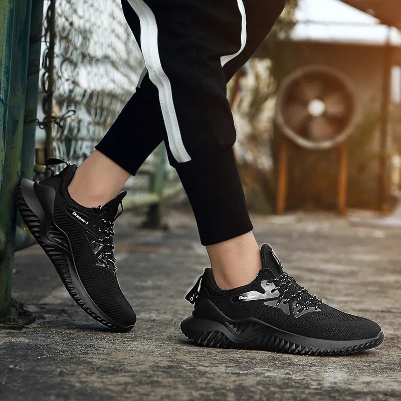 Low-top adult running shoes in a plain style with a front strap and mesh upper.