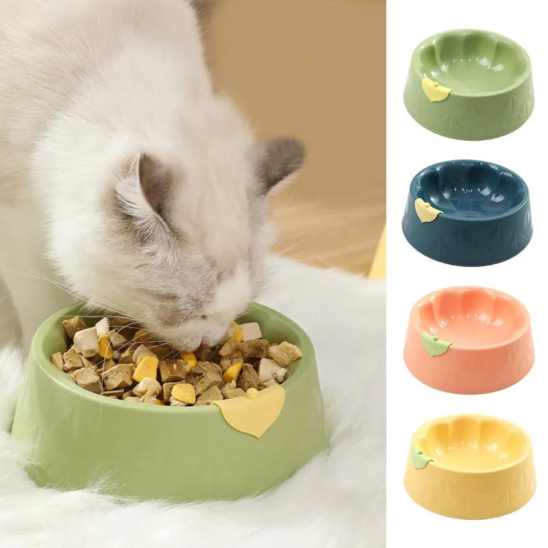 Green plastic double pet bowl with flower-shaped feeding areas and anti-tipping base design