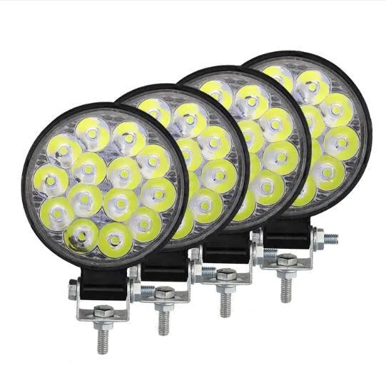 Mini round aluminium car LED work light with white light, shown for off-road vehicle installation.