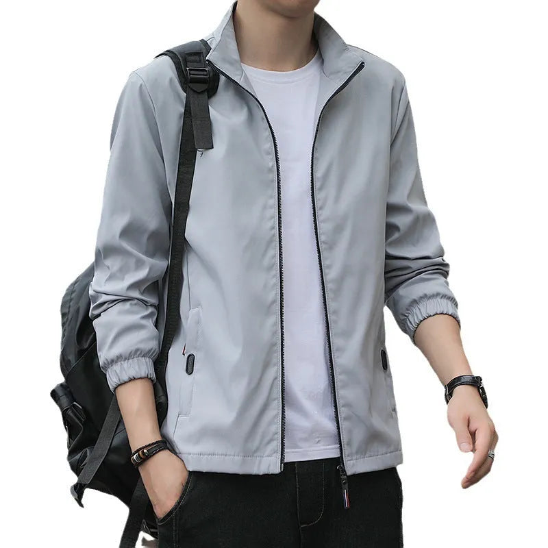 Korean-style loose fit lapel jacket for men in a blue colour, shown with zipper and pocket details.