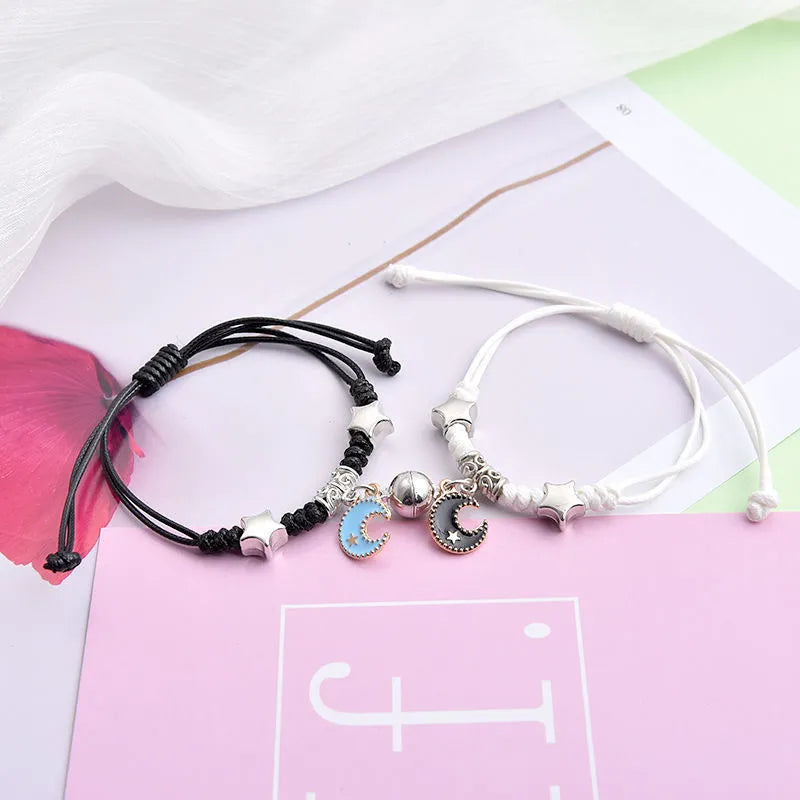 Alloy magnetic suction bracelet pair for couples with symbolic design options