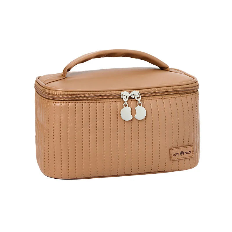 Open-top PU leather makeup bag in a solid colour from a choice of six options.
