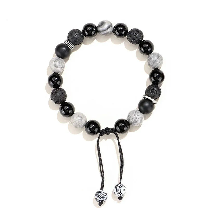 Black agate volcanic rock bracelet with diamond-cut facets, shown in two width sizes.
