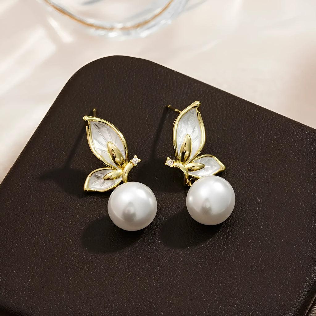 A pair of simple style copper butterfly earrings for women with an electroplated painted oil design.