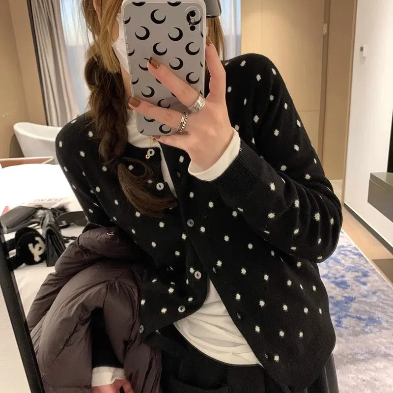 Women's grey dot pattern knitted cardigan with long sleeves and crocheted flower details