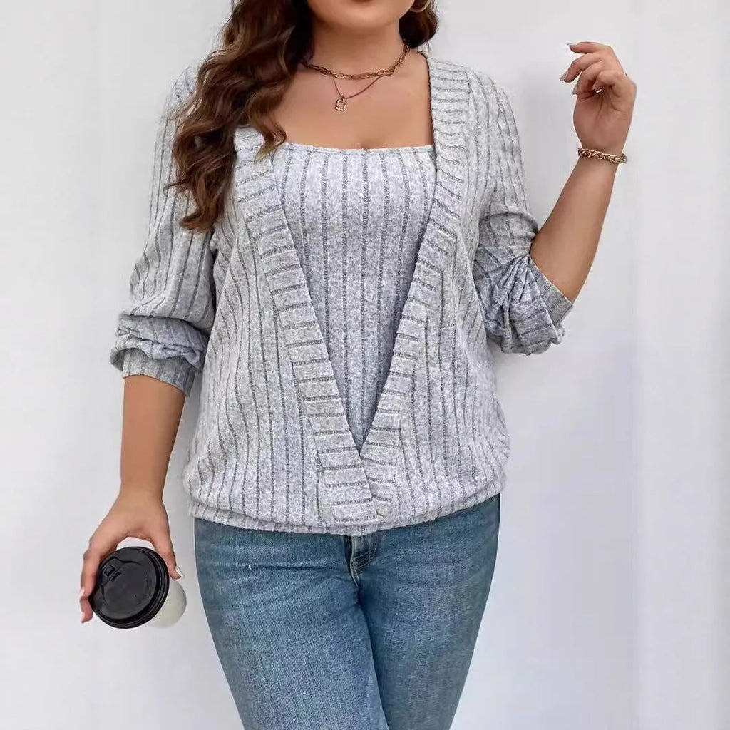 Women's solid colour false two-piece suit with V-neck and long sleeves in polyester rib fabric.