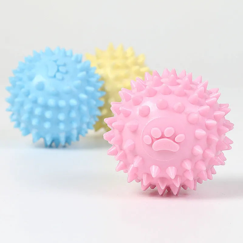 Blue TPR dog chew ball with footprint pattern and raised texture for dental cleaning