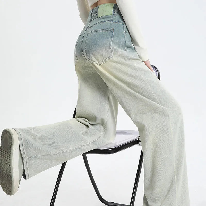 Women's gradient blue cotton denim wide-leg straight trousers on a hanger.