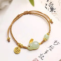 Women's rabbit bracelet with Hetian jade geometric charm on yellow string