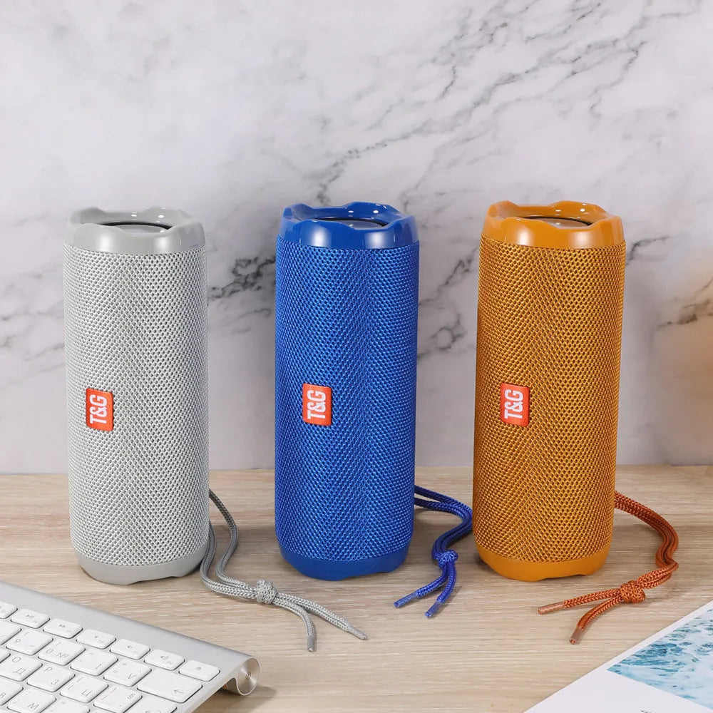 Fabric-covered portable Bluetooth speaker with a card slot in multiple colour options.