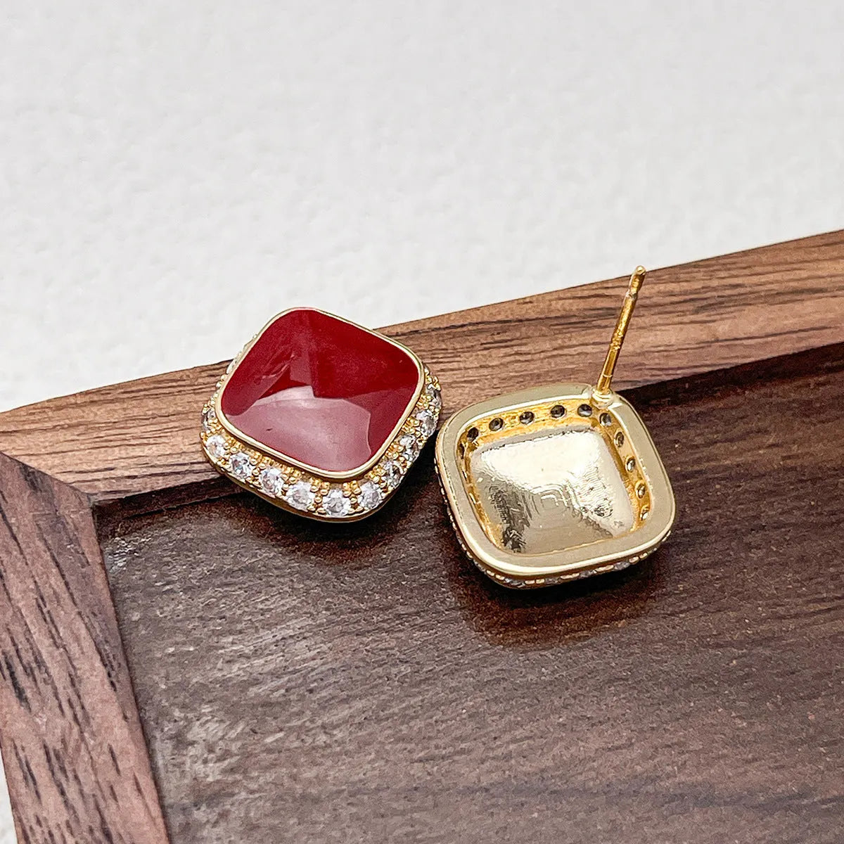 Red square plate earrings with geometric alloy construction and retro styling