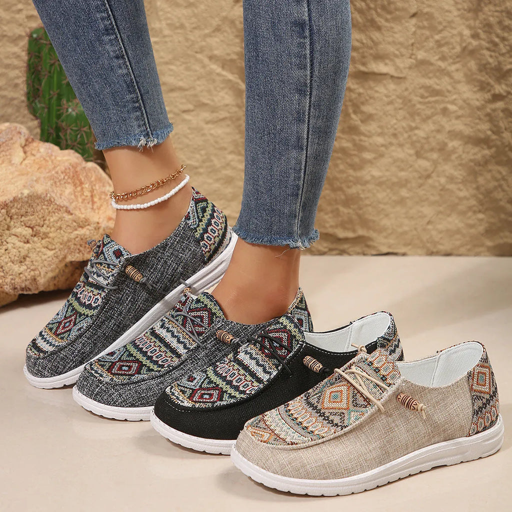 Women's black round toe flat shoes with a low-top PU upper and rubber sole on a plain background.