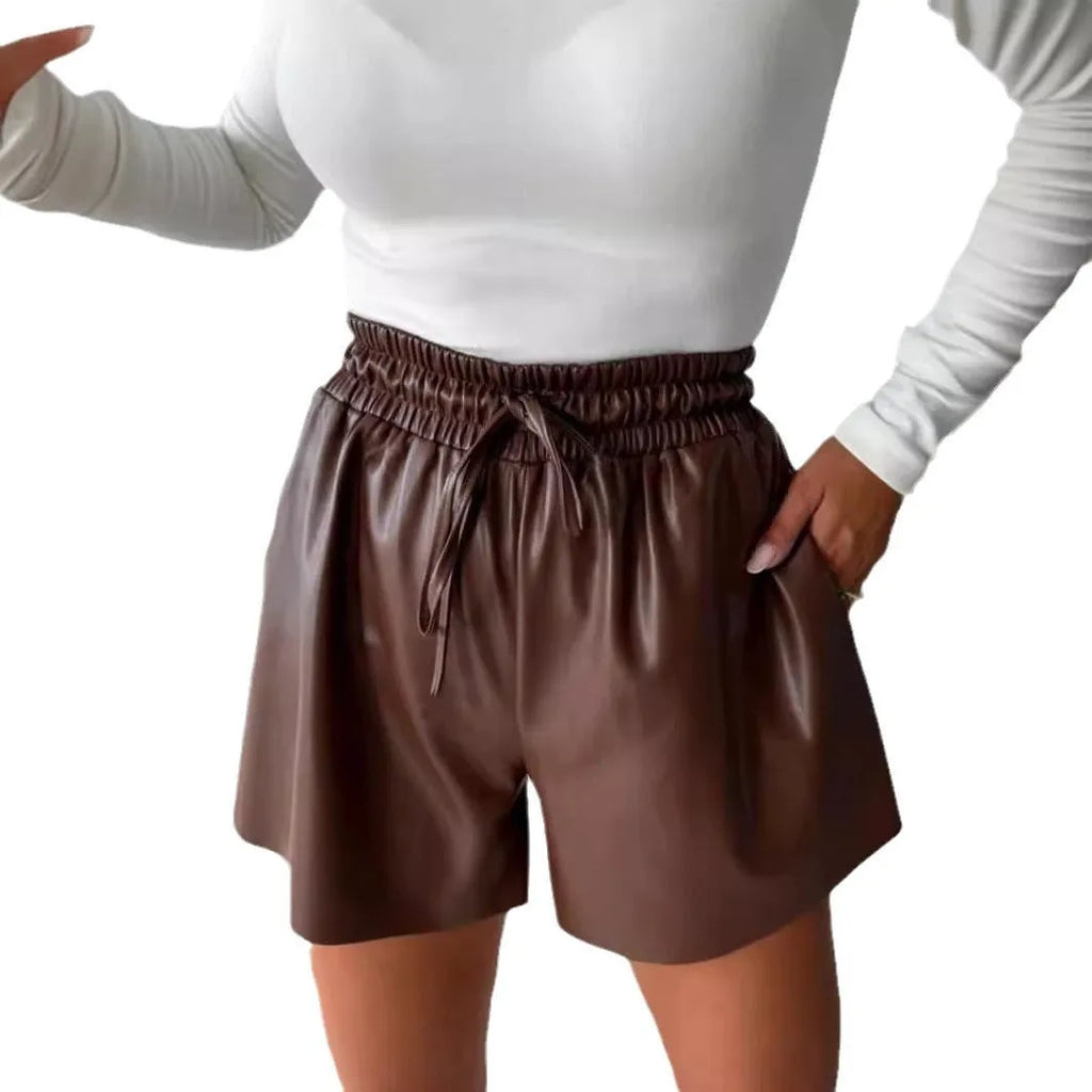 Women's black PU leather wide-leg shorts with a front lace-up drawstring waist detail.