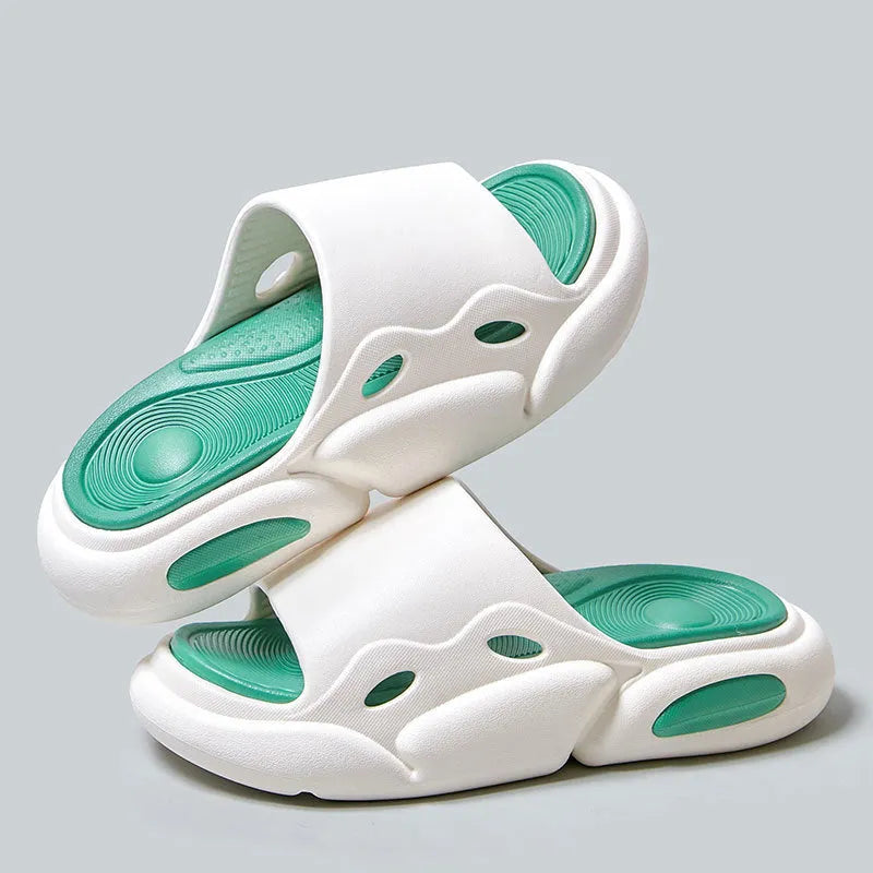 A pair of unisex EVA foam slippers with a thick sole and leather lining, shown in a two-colour design.