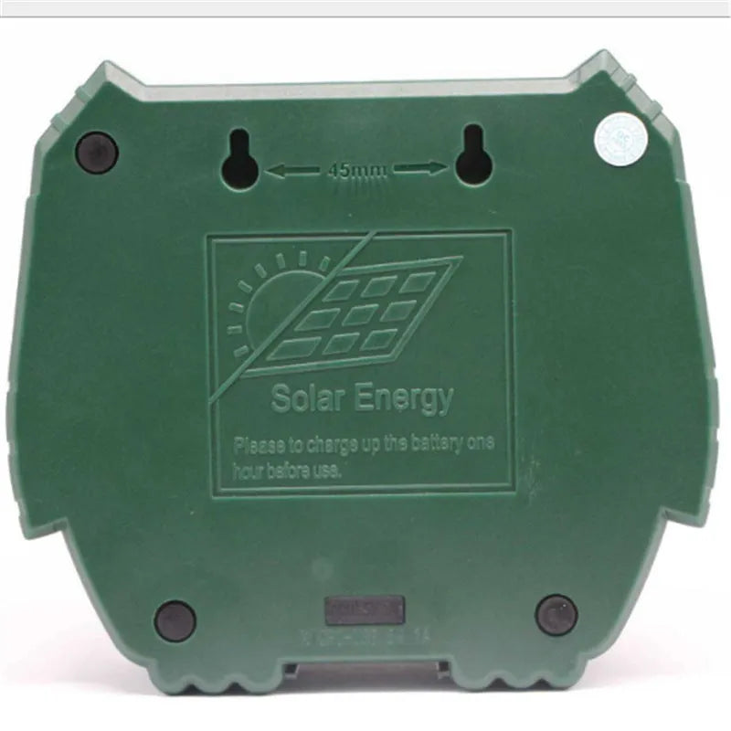 Green solar-powered ultrasonic dog and pest repeller unit for outdoor garden use.