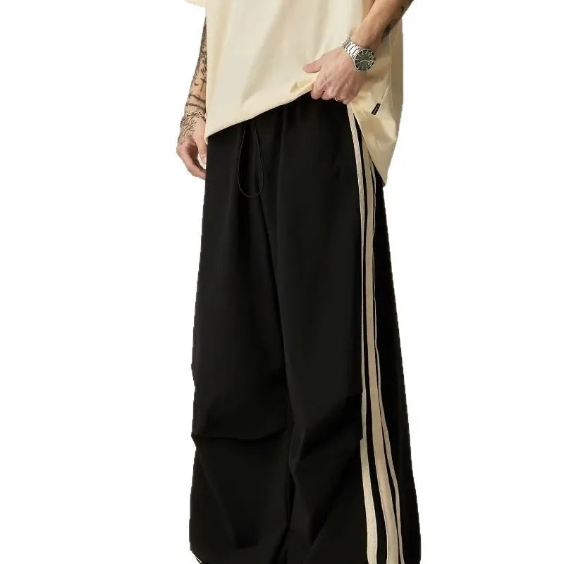 Black men's wide leg climbing trousers with high waist and straight leg design.