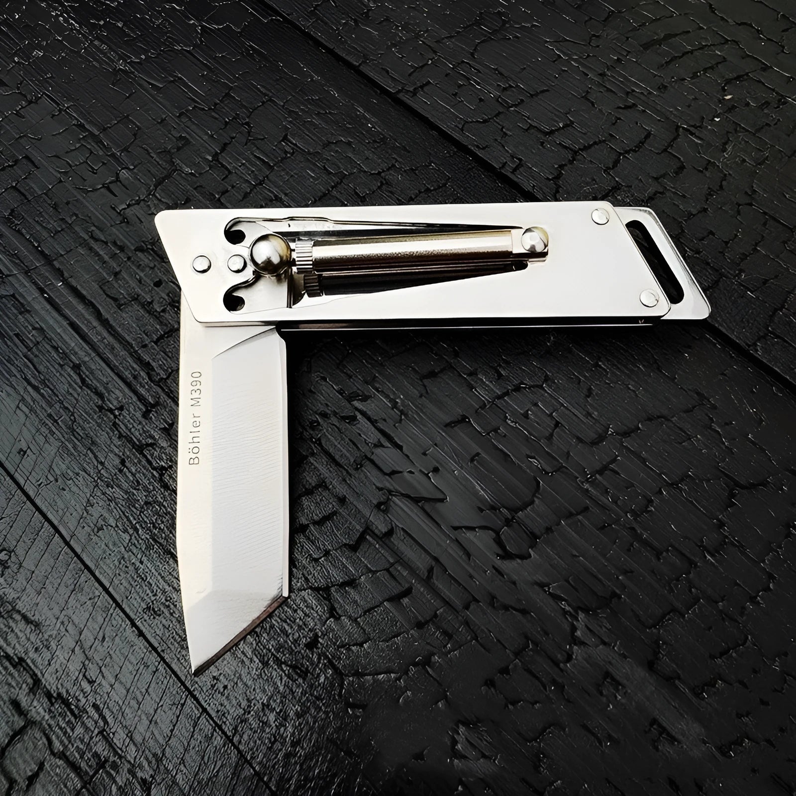 Heavy-duty folding stainless steel utility knife with neutral finish, closed position