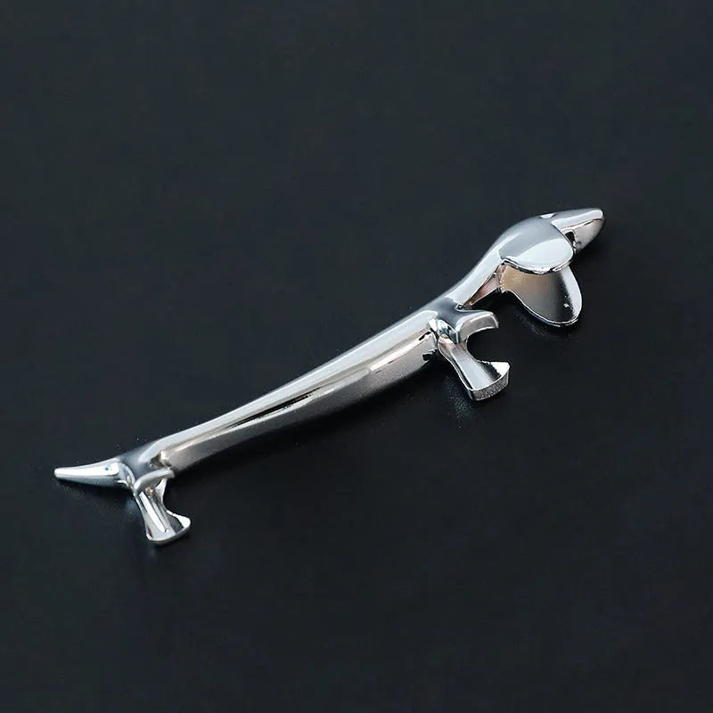 Silver zinc alloy sausage dog chopstick rest on a table