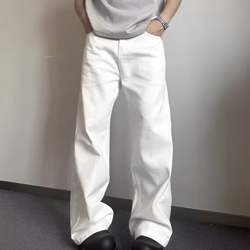 Men's white loose fit wide-leg straight denim jeans on a mid-waist model.