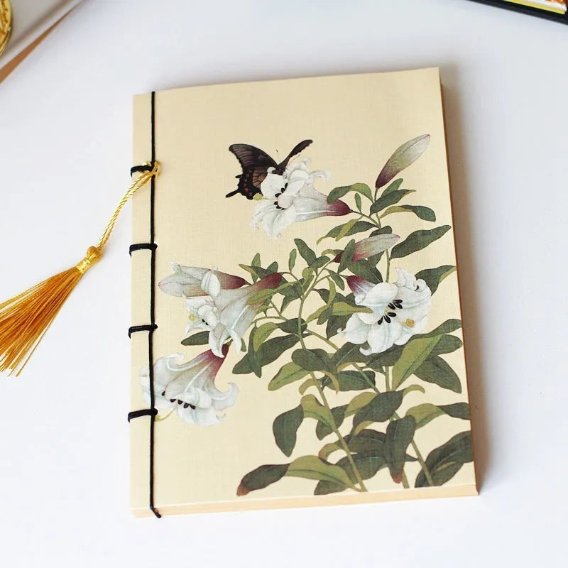 A5 antique thread-bound notebook with embossed cover and decorative tassels