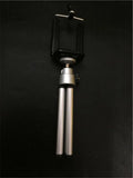 Black and silver desktop phone holder with adjustable two-section bracket on wooden desk