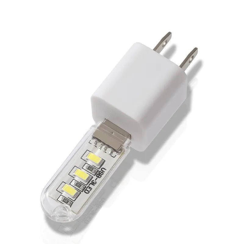 Compact USB-powered LED baby night light showing warm and white light colour options.