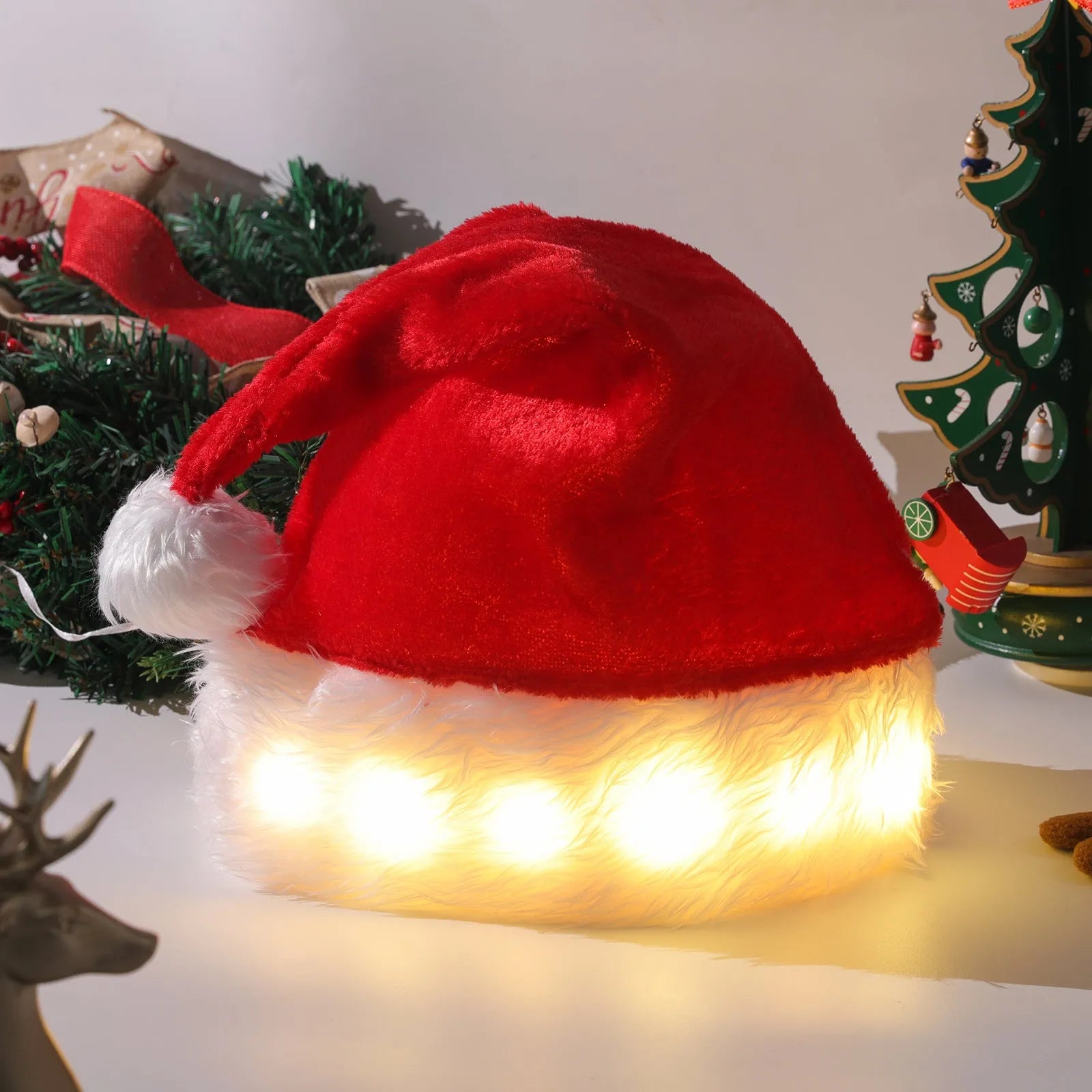 Red and white plush Santa hat with LED lights glowing in multiple colours, pom-pom decoration