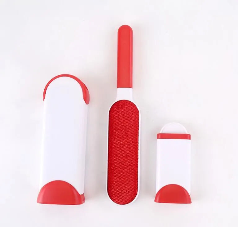 Blue reusable pet hair removal comb with double-sided brush next to its self-cleaning base.