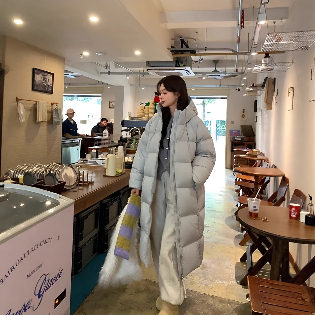 Women's mid-length loose padded puffer coat in beige with white duck down filler and pocket