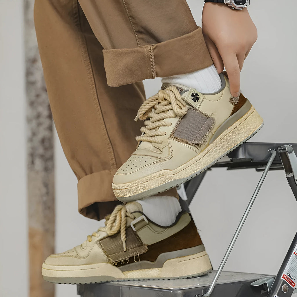 Beige vintage patch skateboard shoes with low-top design and round toe