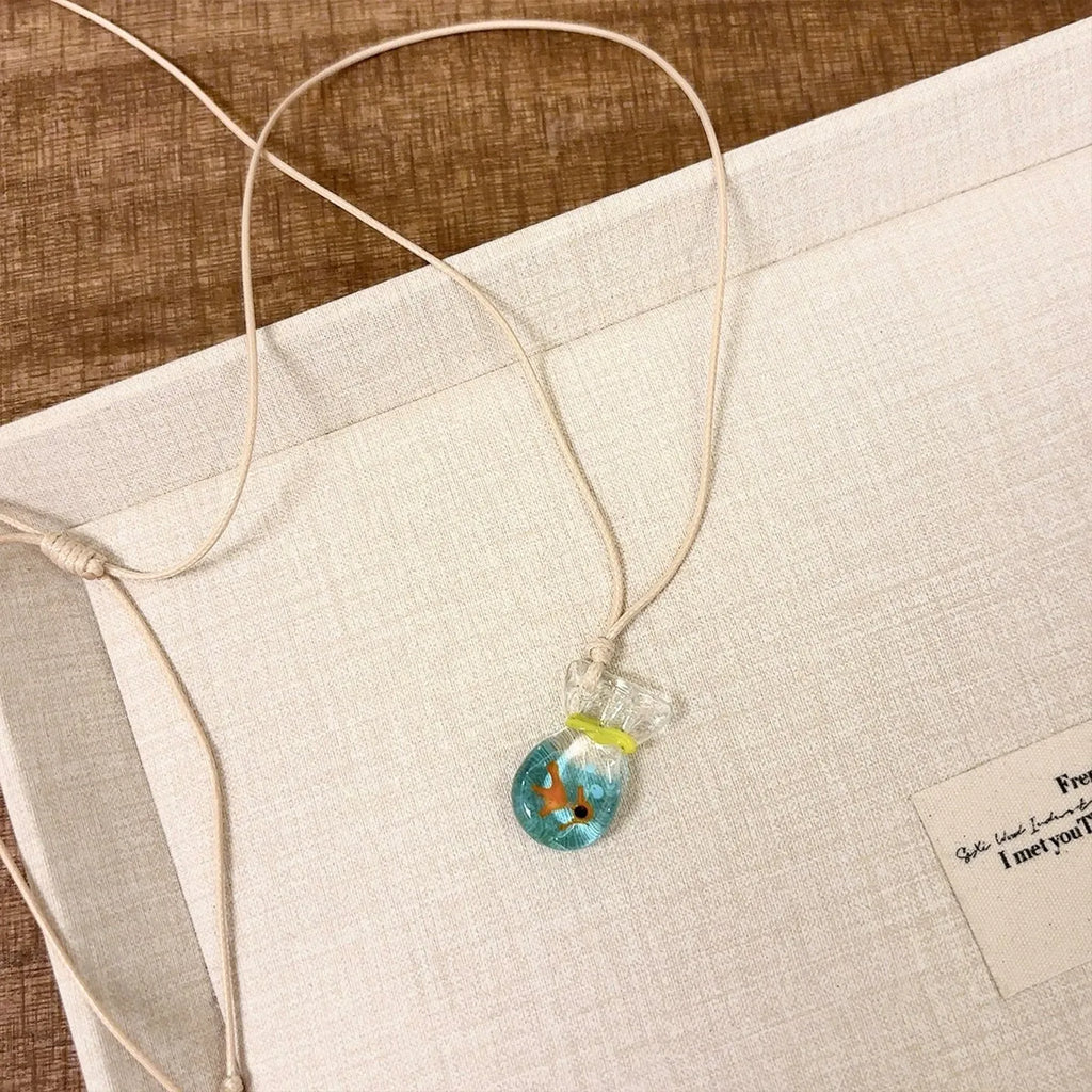 Women's skirt and joker pendant necklace with coloured glaze on cotton linen chain