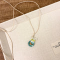 Women's skirt and joker pendant necklace with coloured glaze on cotton linen chain