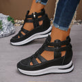 Women's black close-toed sandals with hollow-out patterning and platform sole, showing Velcro fastening