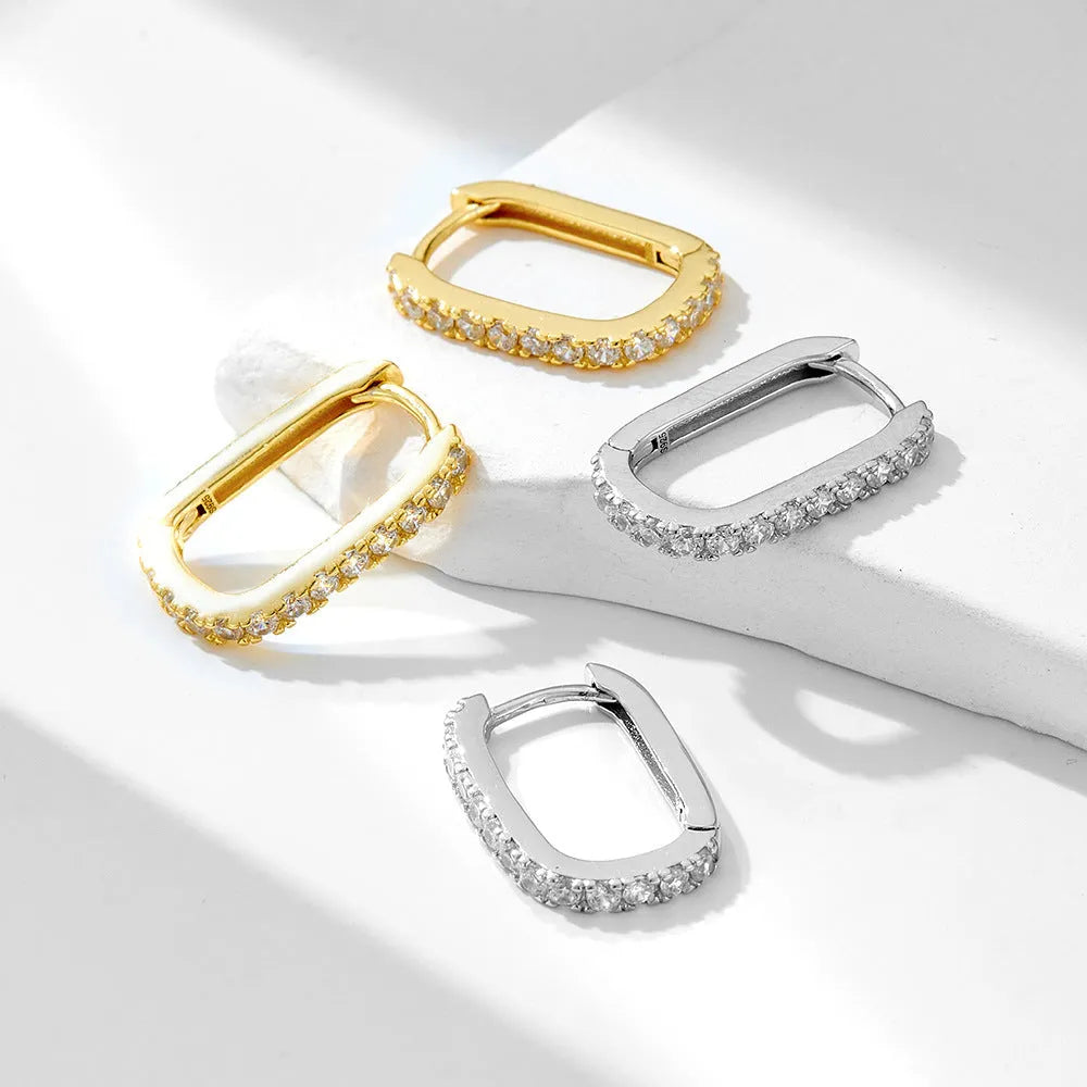 Women's oval zircon geometric earrings in sterling silver with ear clip fitting.