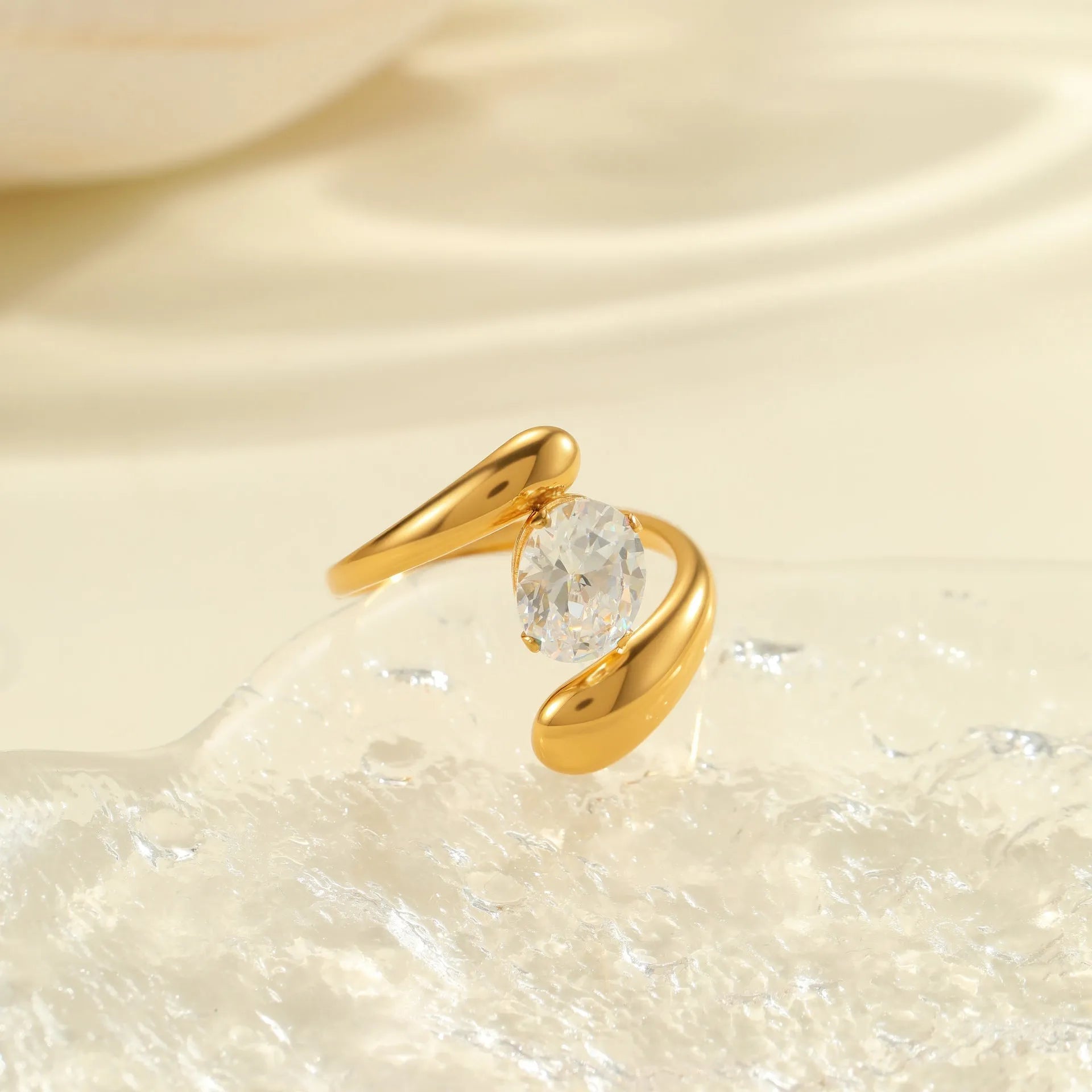 Women's stainless steel geometric zircon ring with open mouth design on a hand.