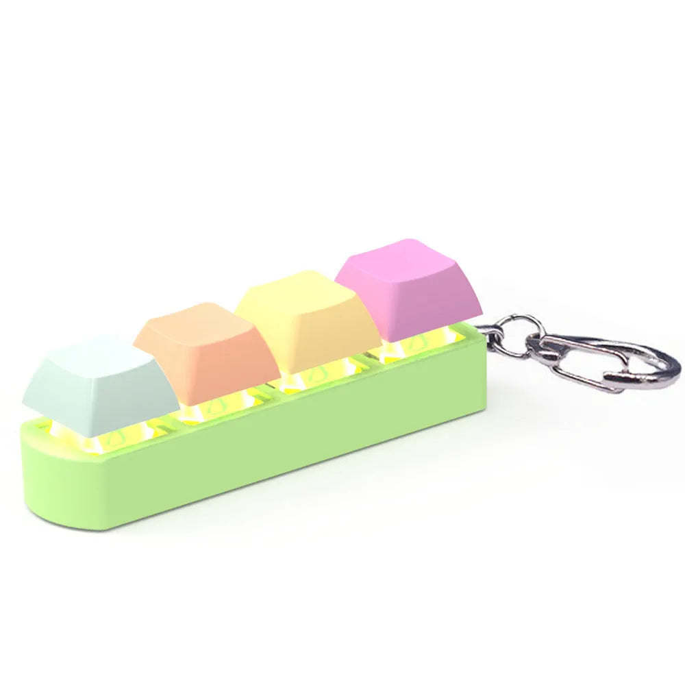 A blue, orange, yellow, and purple 4-key shaft tester fidget toy with a transparent bottom shell.