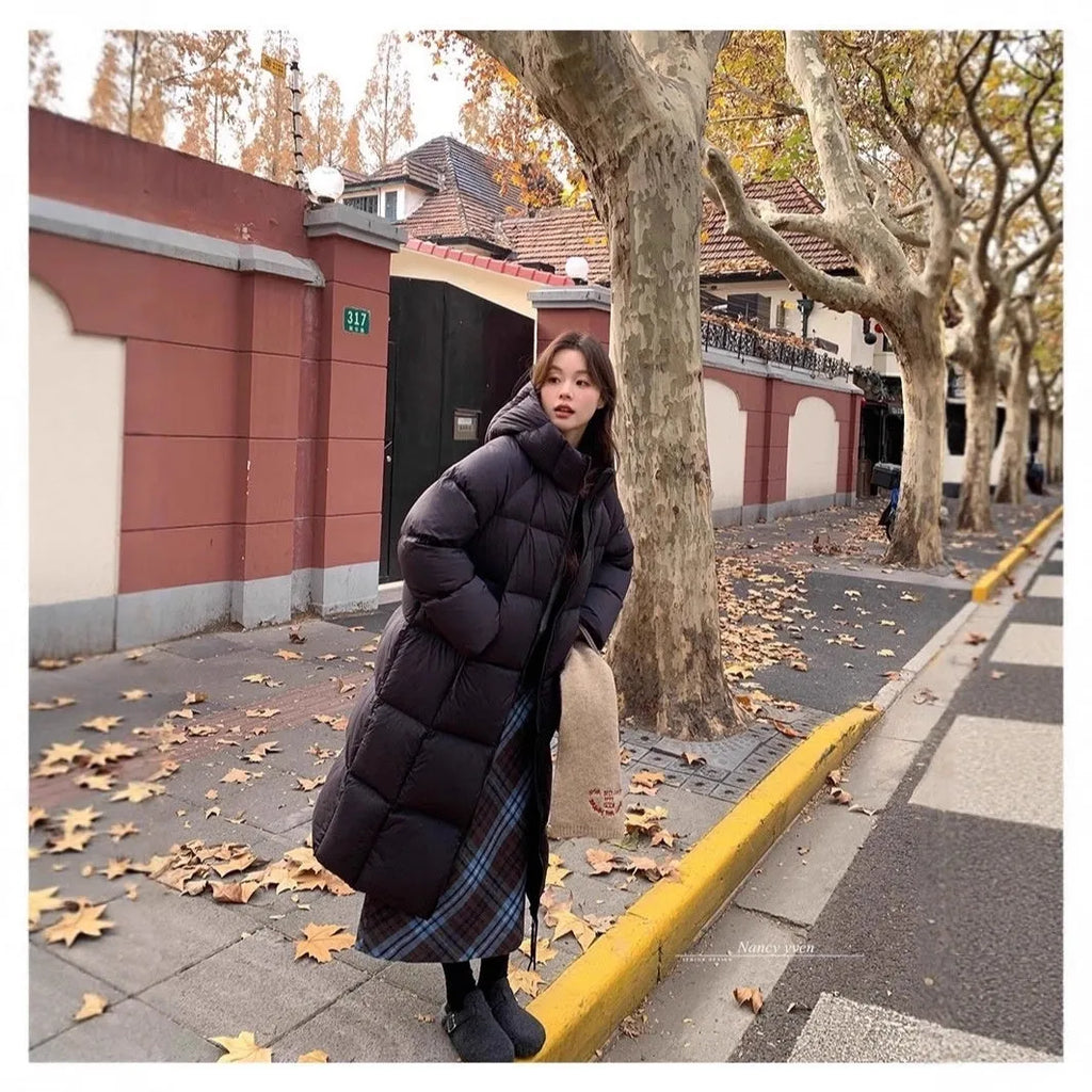 Women's mid-length loose padded puffer coat in beige with white duck down filler and pocket
