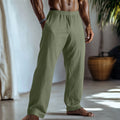 Straight-leg casual trousers in cotton and linen fabric, shown in light green colour with visible pockets.